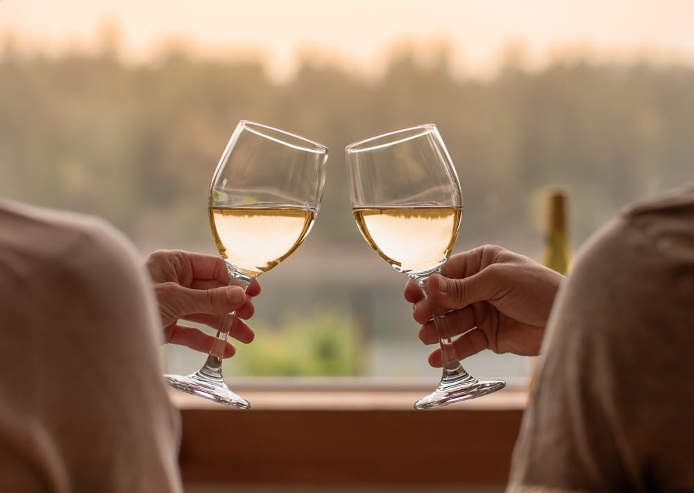 Couple drinking wine during honeymoons, anniversaries and more at our North Georgia Bed and Breakfast