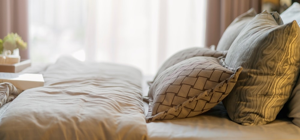 A closeup of a bed at one of the best Midwest Lodging properties