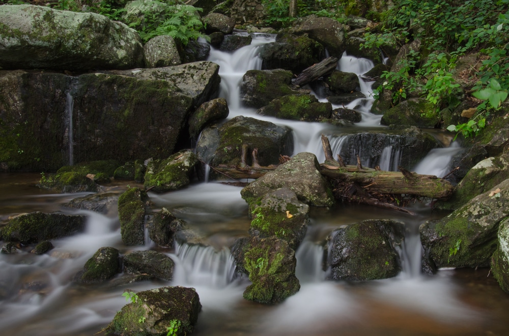 water cascading over rocks at Crabtree Falls, VA, one of the best waterfalls in Virginia