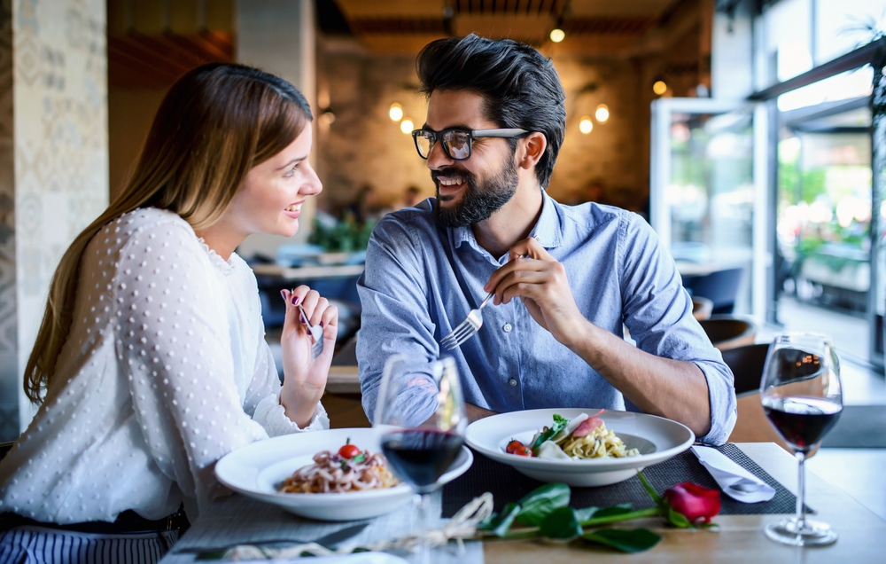 A picture of a man and woman enjoying a meal together at the top restaurants in Staunton, VA