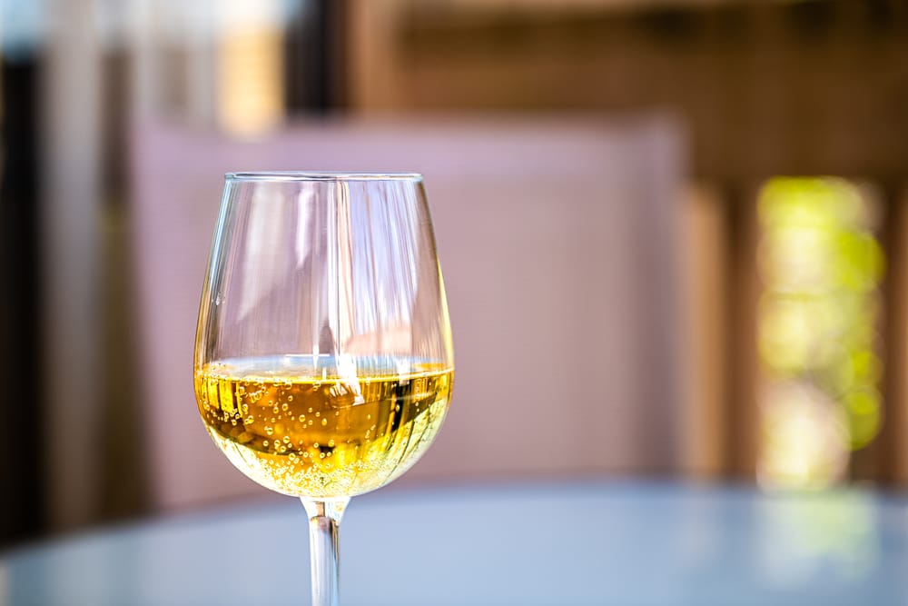 Glass of white wine at top Virginia wineries, like the Rockbridge Vineyard and Brewery