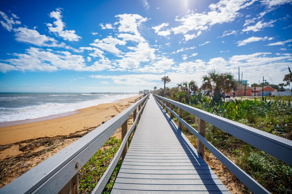 The best time to visit Florida is now. Walk the gorgeous Flagler Beach boardwalk and see the cinnamon sand.