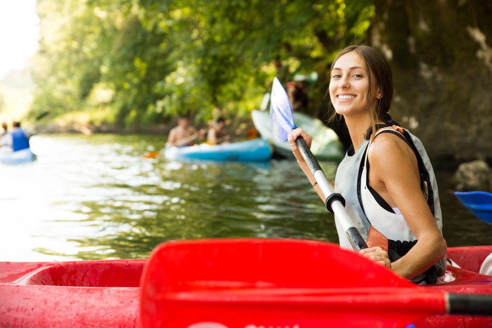 Young woman enjoying Green River Gorge Kayaking near Saluda