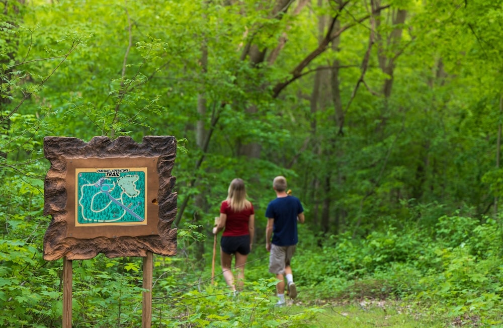 People hiking through the wooded trails at our Bed and Breakfast in Wisconsin, near the Kettle Moraine Scenic Drive