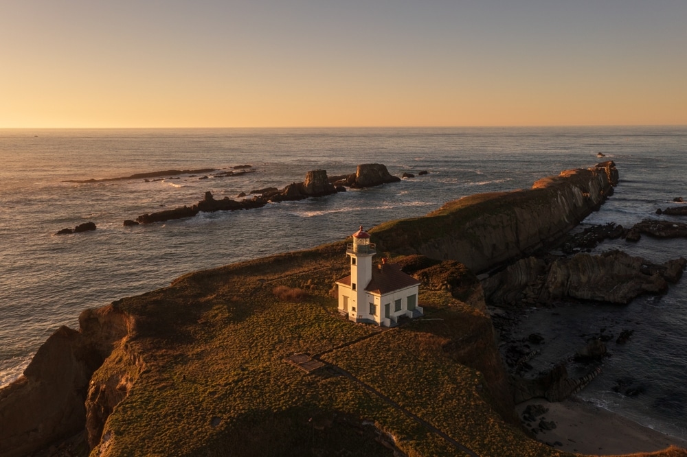 Cape Arago Lighthouse at sunset is one of the best Oregon Coast lighthouses near Bandon