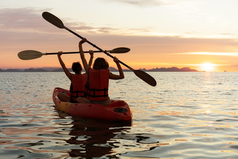 Kayaking at sunset on Eagle Harbor is one of the best things to do in the Marina District on Bainbridge Island.