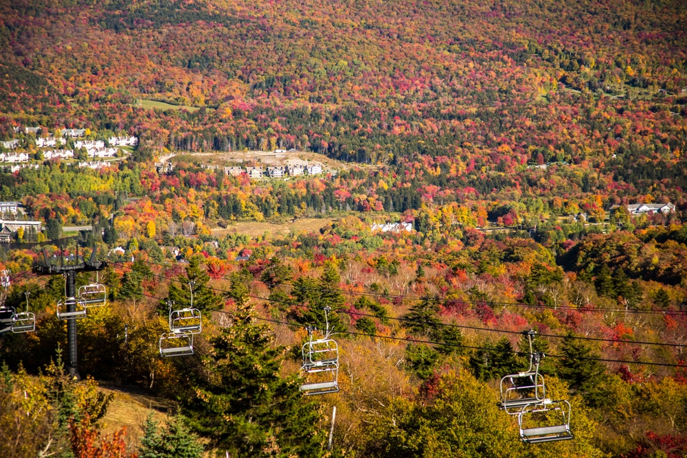 View from the chair lift on Mt Snow Vermont,. Mt Snow and the surrounding lands are covered with dense hardwood forests, all exhibiting peak fall color.