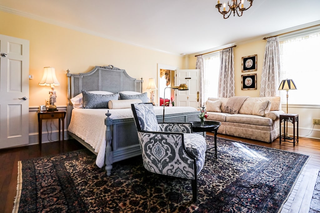 Stay at one of the best luxury Exeter hotels. Enjoy this beautiful room with a blue upholstered chair and couch.