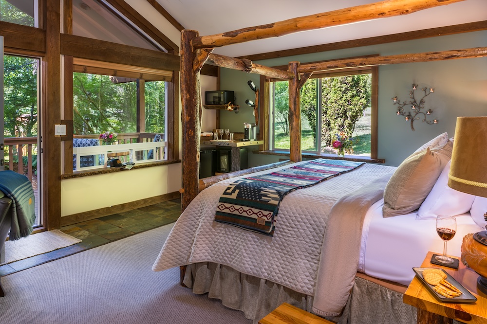 Interior bed and view at one of our cabins in Washington, the most romantic couples retreat near Seattle