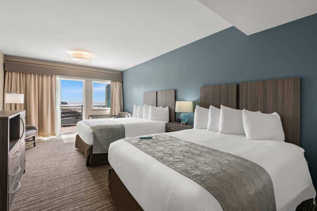 Room with two queen beds and ocean view at our Bandon Oregon hotel.