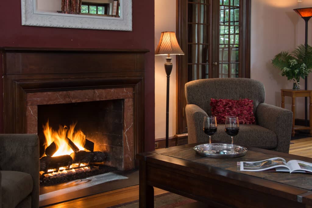 Relax after a day at Mount Snow Ski Resort by the fire in the living room at our Boutique Hotel in Brattleboro.