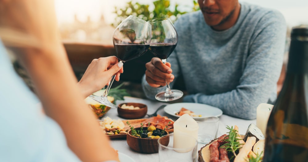 A couple enjoying a romantic meal out with wine at one of the best restaurants in Lexington, VA