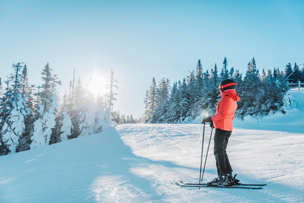 Woman downhill skiing at Mount Snow Ski Resort.