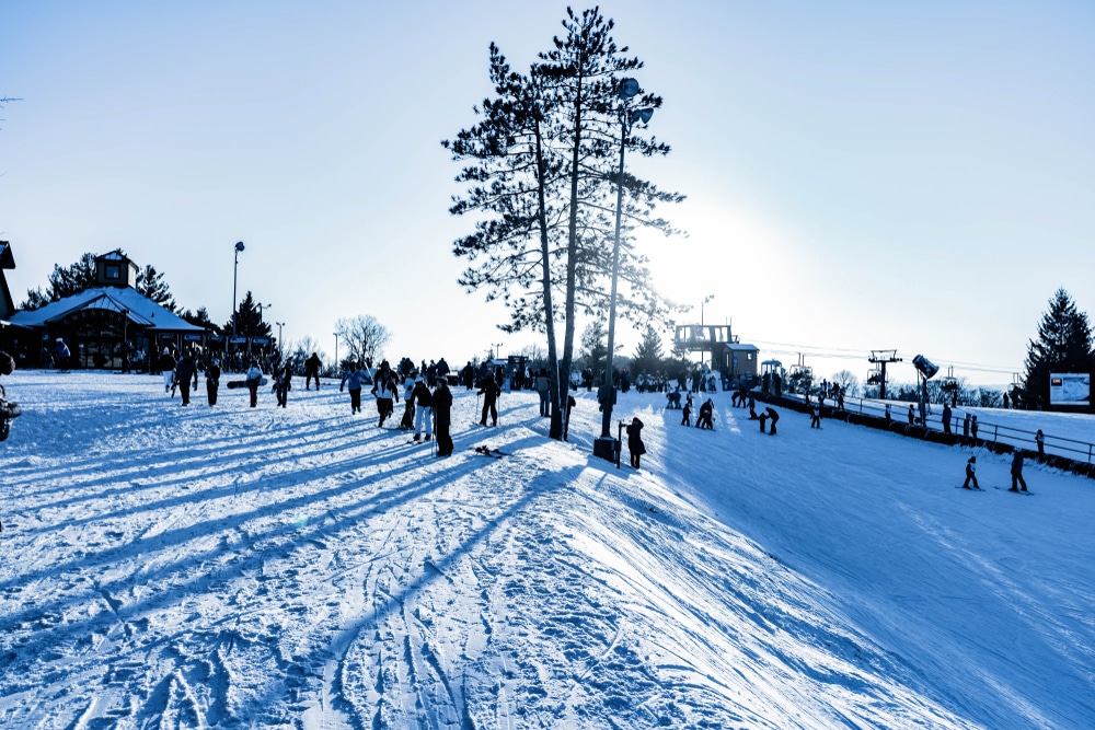 People at the top of the ski hill at Chestnut Mountain Ski Resort in Galena, IL