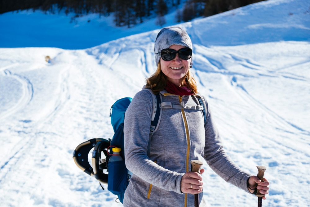 Woman snowshoeing in places like Great Glen Trails in the White Mountains