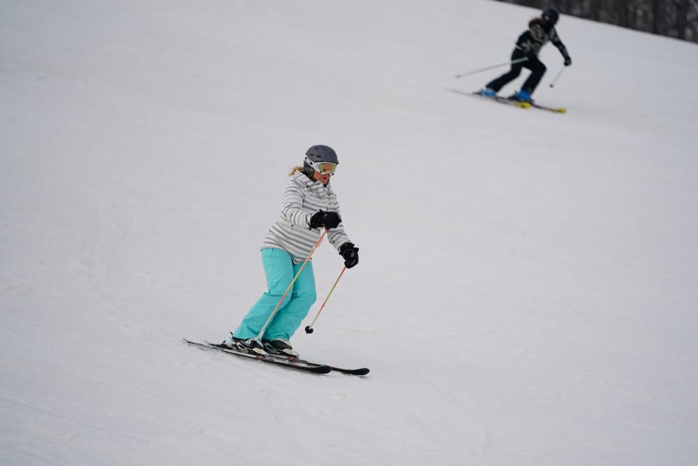 Woman skiing down the slopes at Cascade Mountain Wisconsin