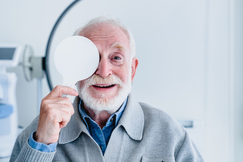 Man getting eye problems from aging eyes checked at our Nashville Optometrist