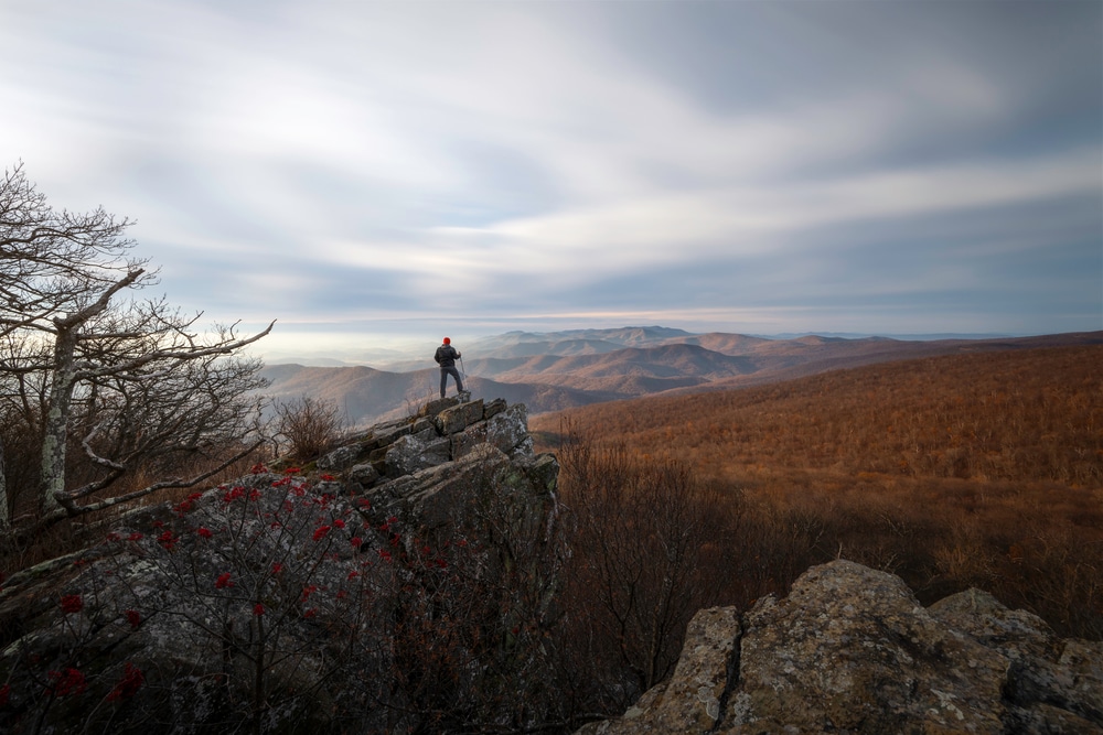 Man enjoying a winter hike in Shenandoah National Park, one of the top things to do in the Shenandoah Valley in the winter
