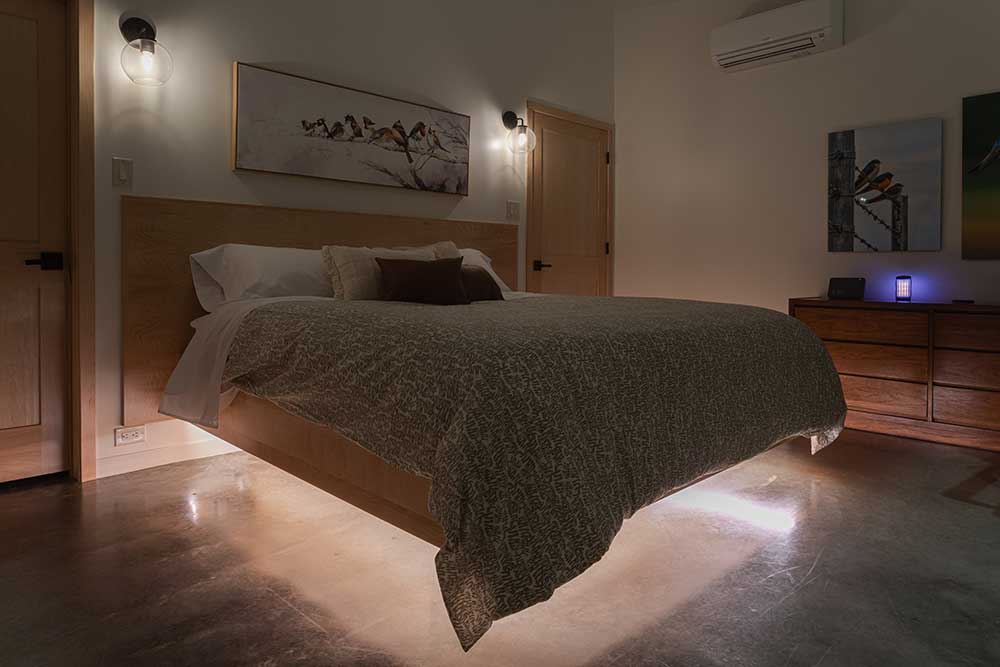 Under lighting on the bed in our luxury cabin in Wisconsin, rated as one of the most unique places to stay in Wisconsin