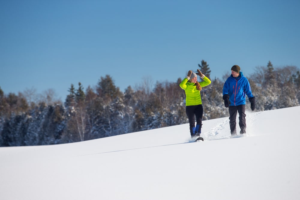 A couple snowshoeing in Vermont