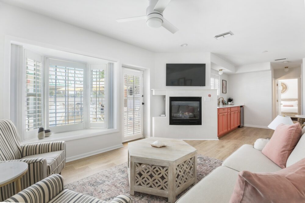 Suite 5 at our romantic getaways in Florida is a larger suite with separate sitting area, fireplace, and oeek-a-boo ocean view.