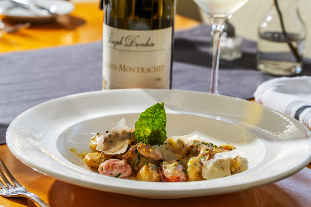 Meal and wine at Restaurant 301, one of the reasons we stand apart from other hotels near Redwoods.