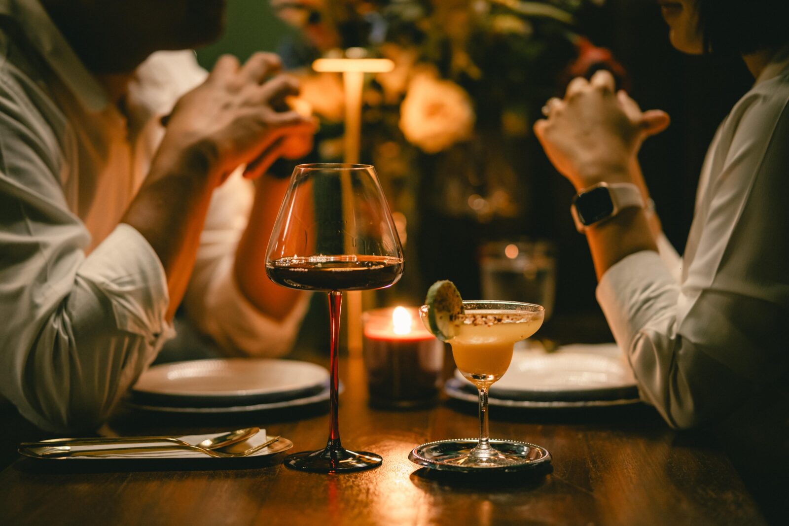 Couple sitting at table in romantic restaurant on Valentine's Day getaway in Duluth.