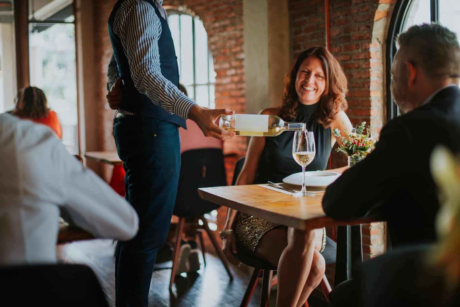 Couple having wine and dinner during their romantic getaways in Nebraska