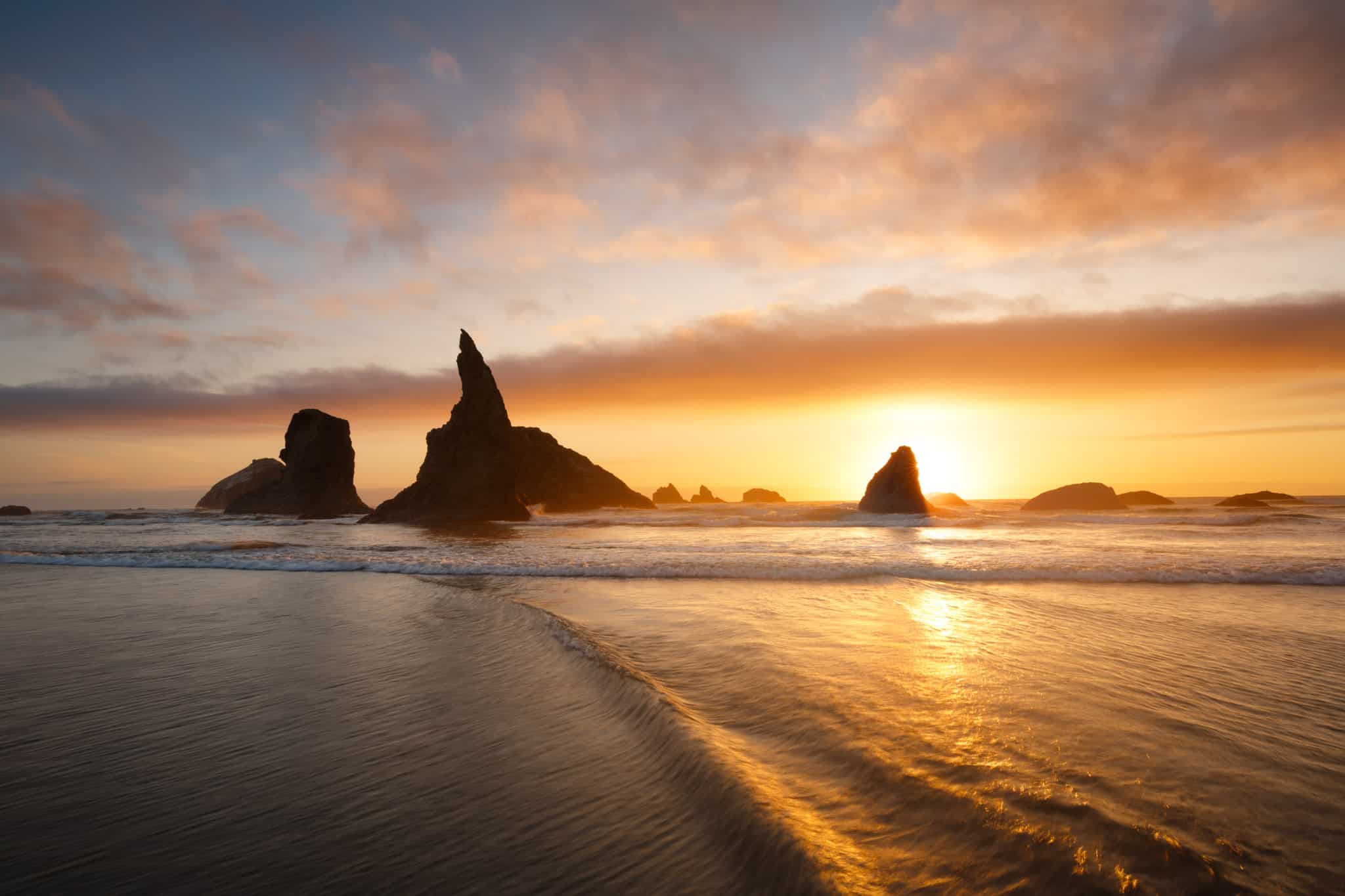 Enjoy Face Rock and the ocean at sunset on Oregon Coast vacations.