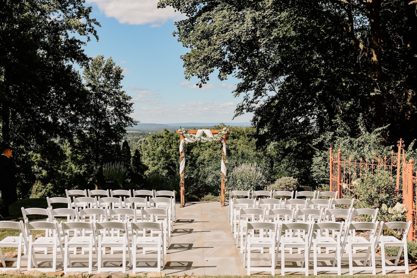 One of the Most Romantic Wedding Venues in Reading PA, photo of an arbor and wedding set up looking out over a mountain valley