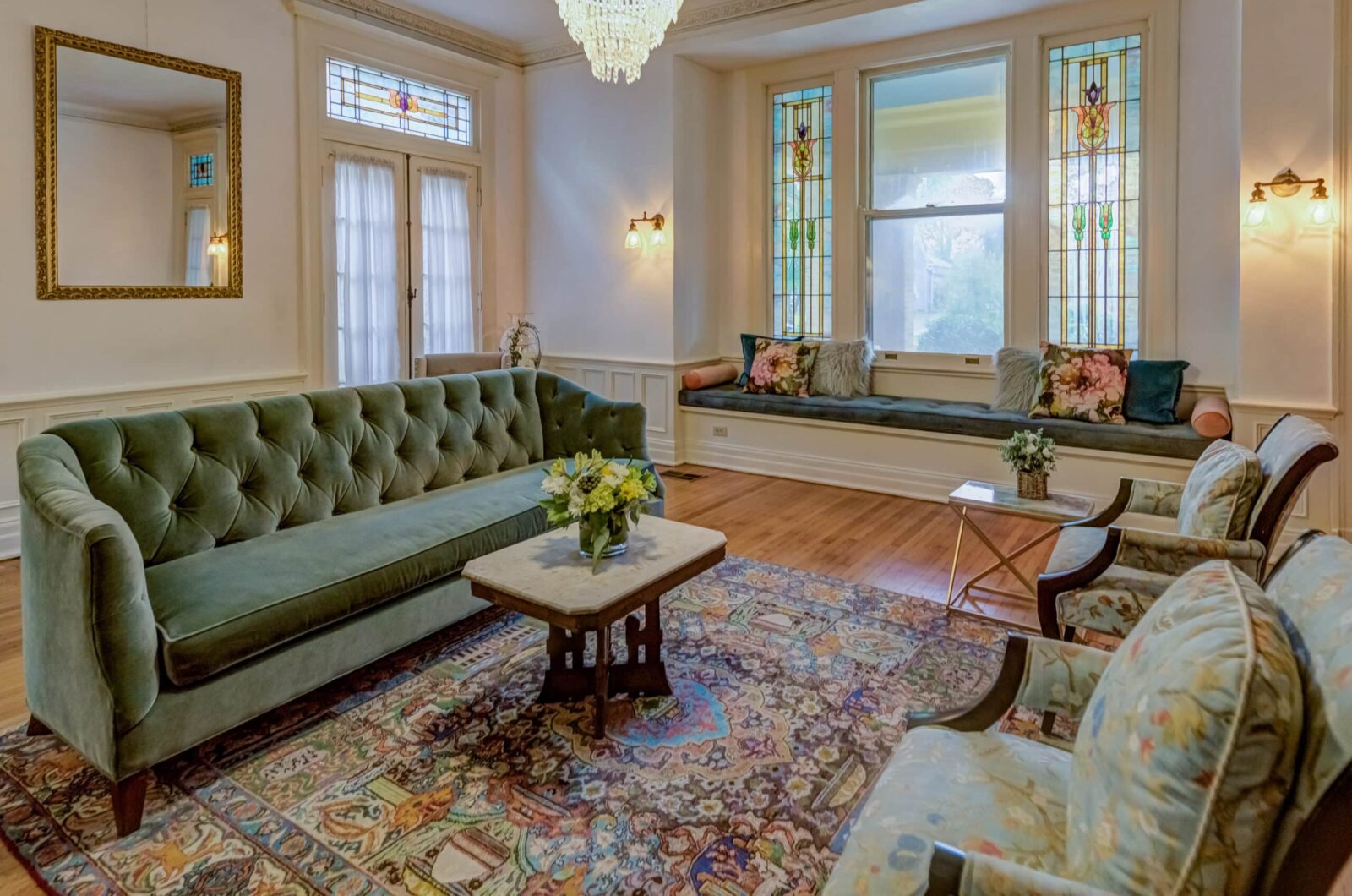 The Lady's Drawing Room with window box seat and original stained glass windows at our Historic Hotel near Vicksburg Civil War Battlefield.