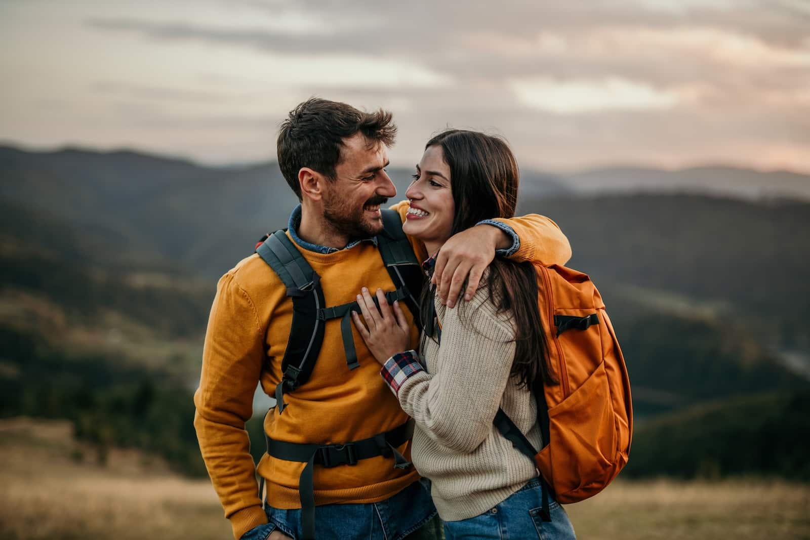 happy couple out hiking and exploring the Mad River Valley is such a fun activity on your Vermont honeymoon