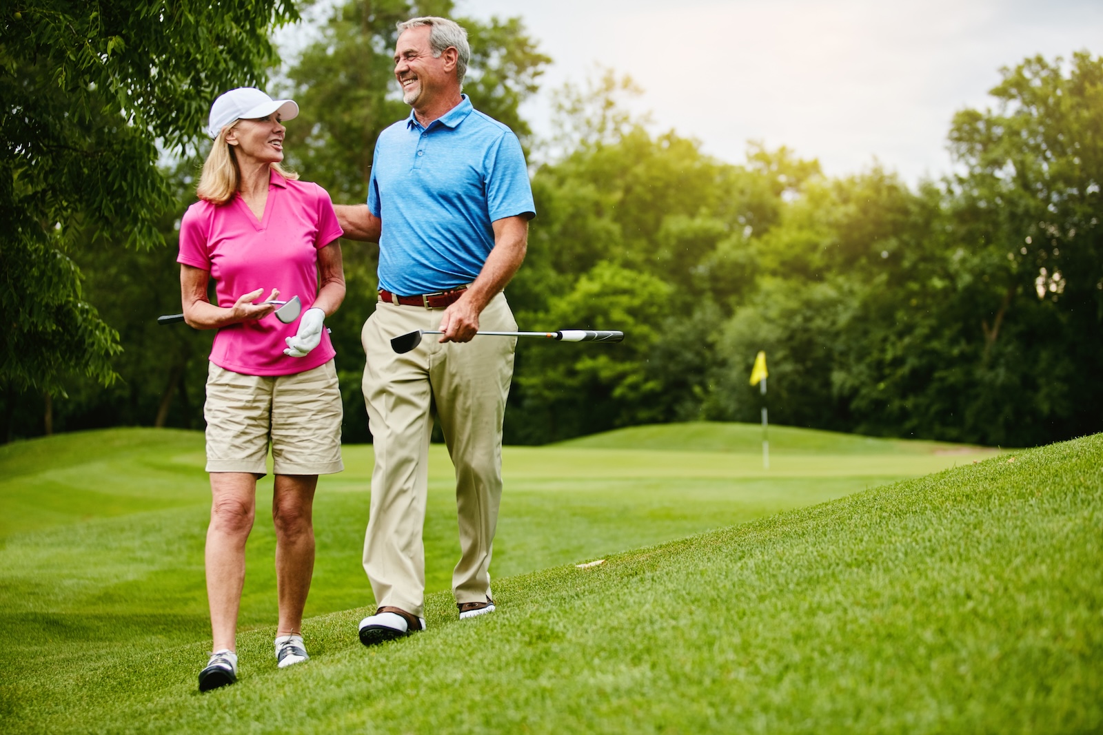 Mature, couple and walk for golf in nature, one of the best things to do near Willow River State park in Hudson Wisconsin