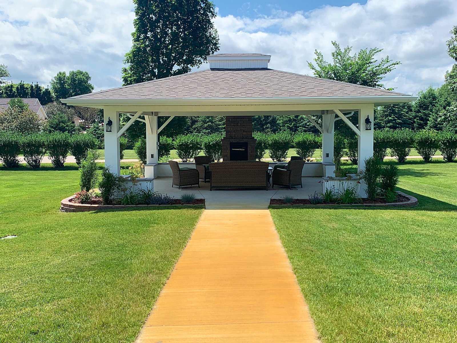 Our charming gazebo in the yard of our Okoboji Iowa hotel, relaxing here is one of the best things to do in Okoboji