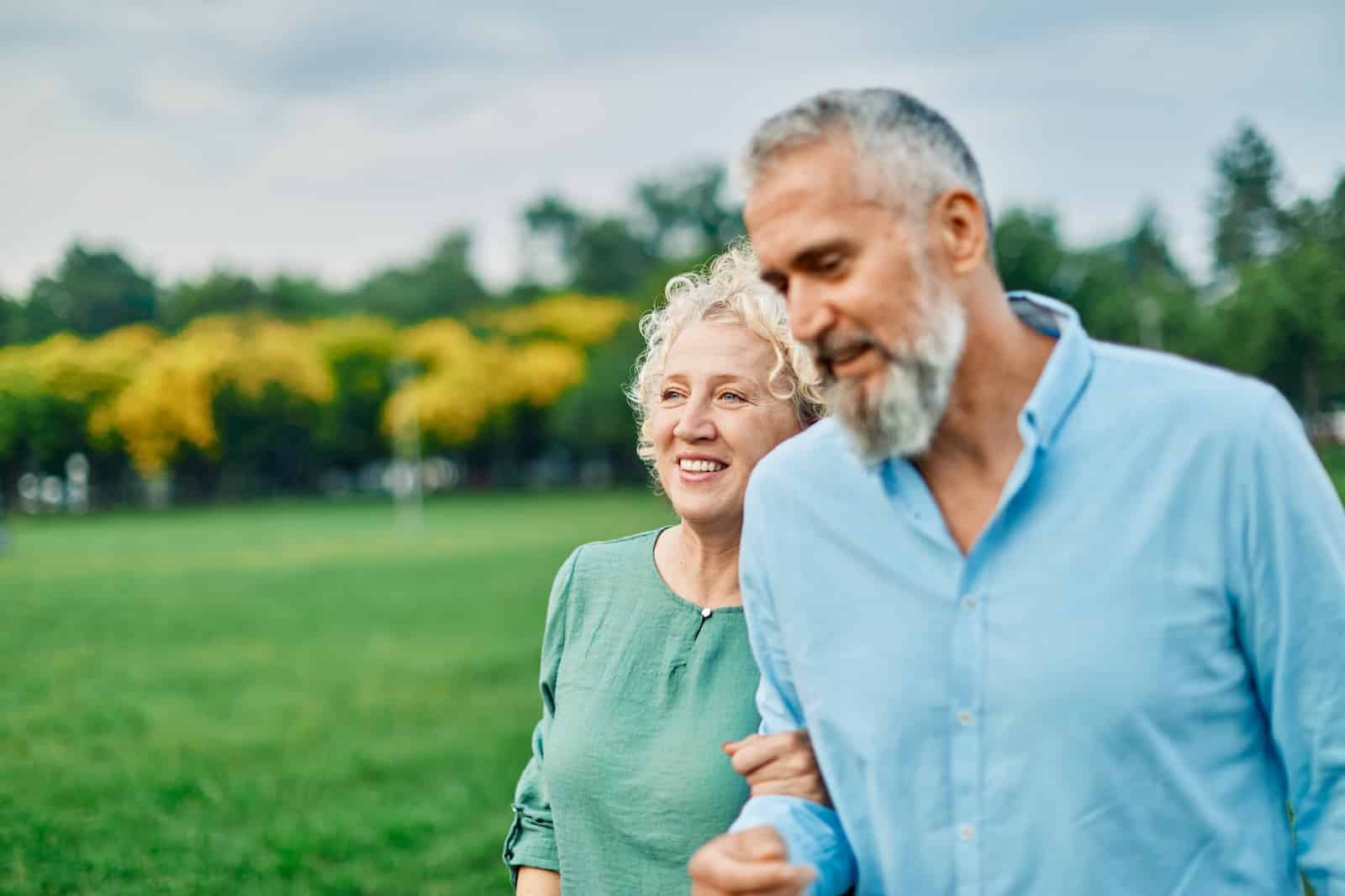 Couple enjoying the fun things to do in Wisconsin, strolling in a beautiful park