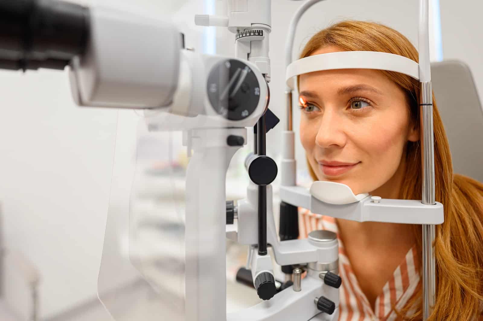 Woman getting an eye exam to check for autoimmune eye disease