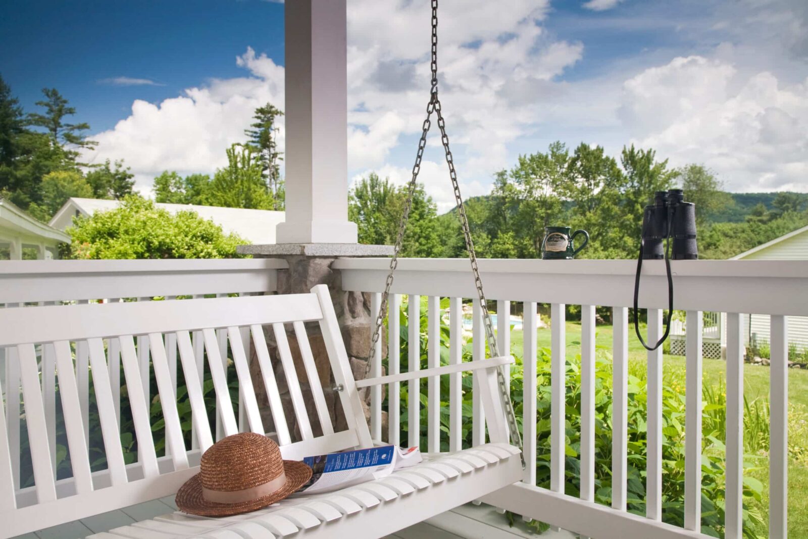 Porch swing on the deck of the Dream Cottage at Sugar Hill Inn in New Hampshire.