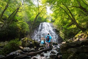 Couple enjoying the waterfalls. Crabtree Falls near White Rock Falls in the Shenandoah Valley.