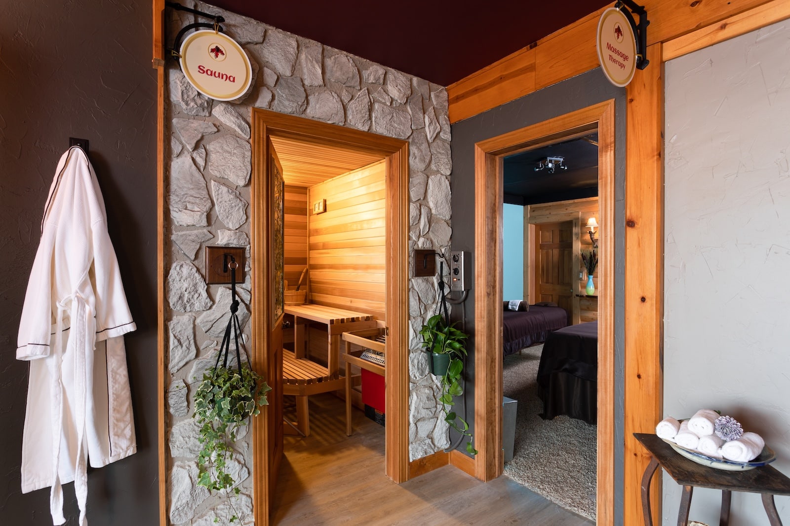 At our Bed and Breakfast in Wisconsin, guests can find a spa, complete with a white robes, a sauna room, and a massage room, all framed by wood and stone exteriors. 