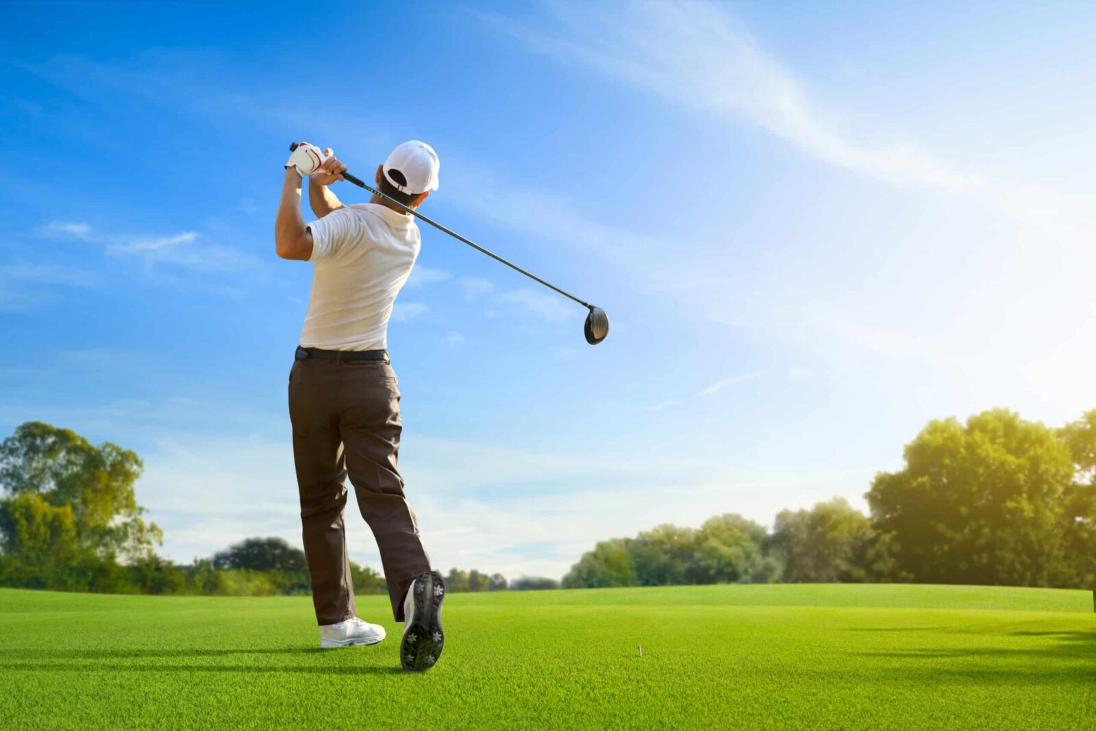 Golfer hits drive down the fair way, Deep Creek Lake golf