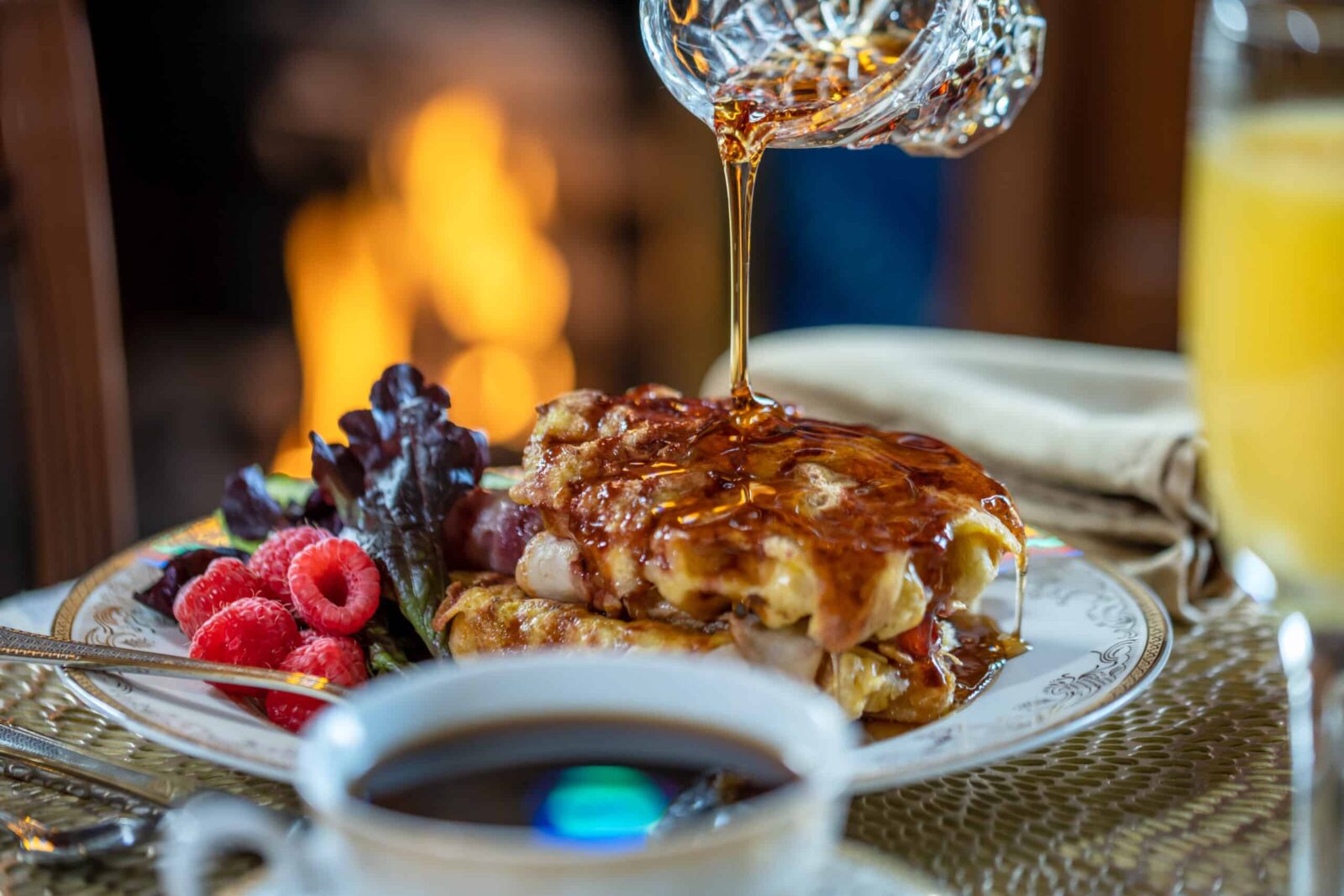 Indulge in a multi-course gourmet breakfast like waffles with raspberries, at Historic Webster House.