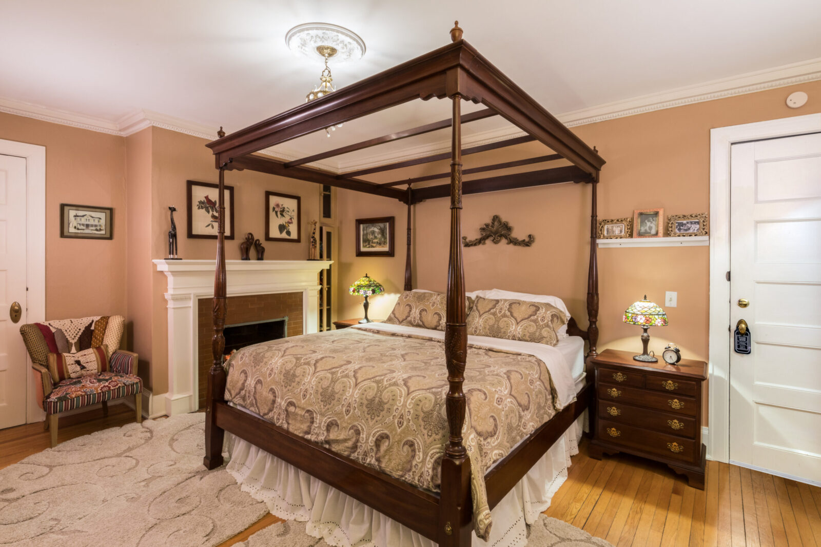 Charles & Edith Room with four poster bed and fireplace at our Devils Lake Bed and Breakfast
