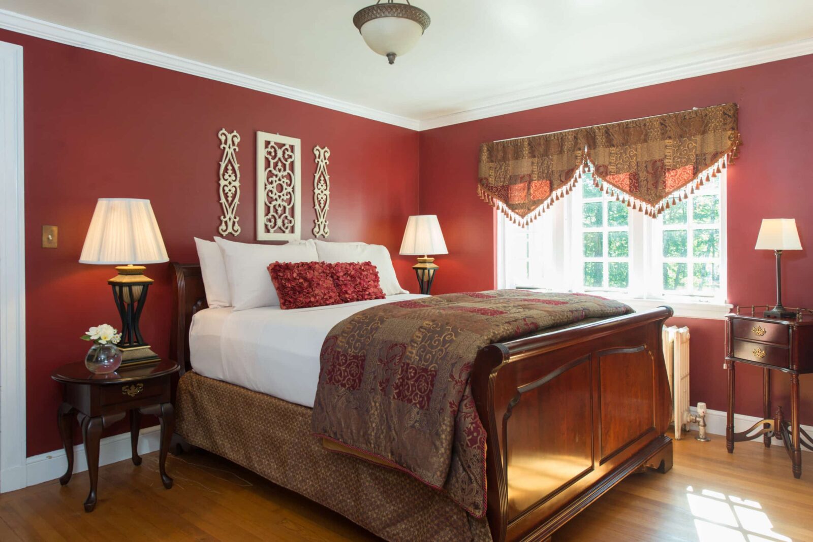 Ripley Suite bed and window at Inn on Putney Road in Brattleboro VT.
