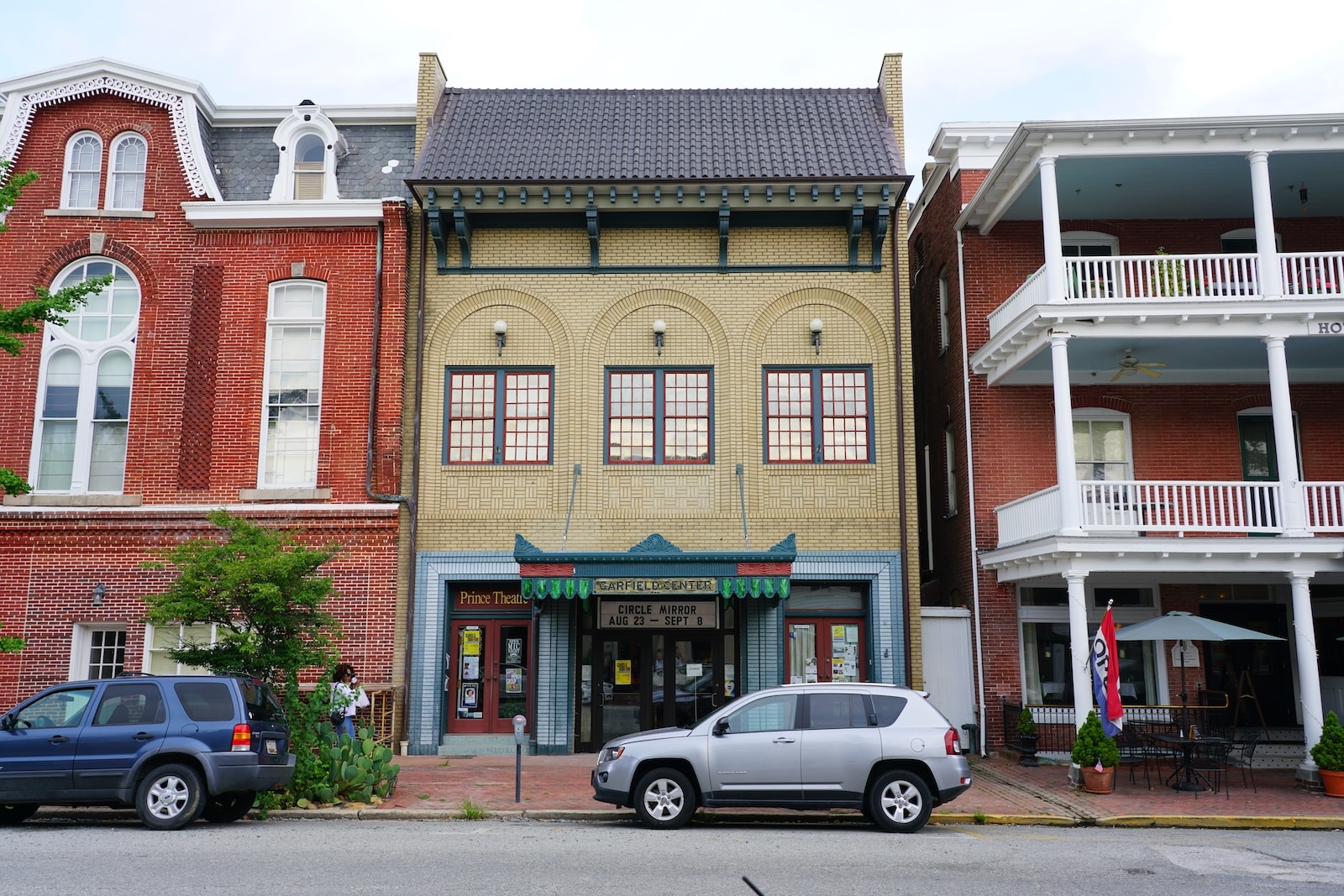 Cars parked on a street in front of historic buildings in the Chestertown Historic District.