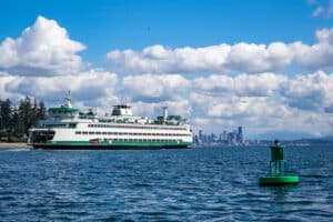 Seattle to Bainbridge ferry in Eagle Harbor, Seatle city skyline in the background.