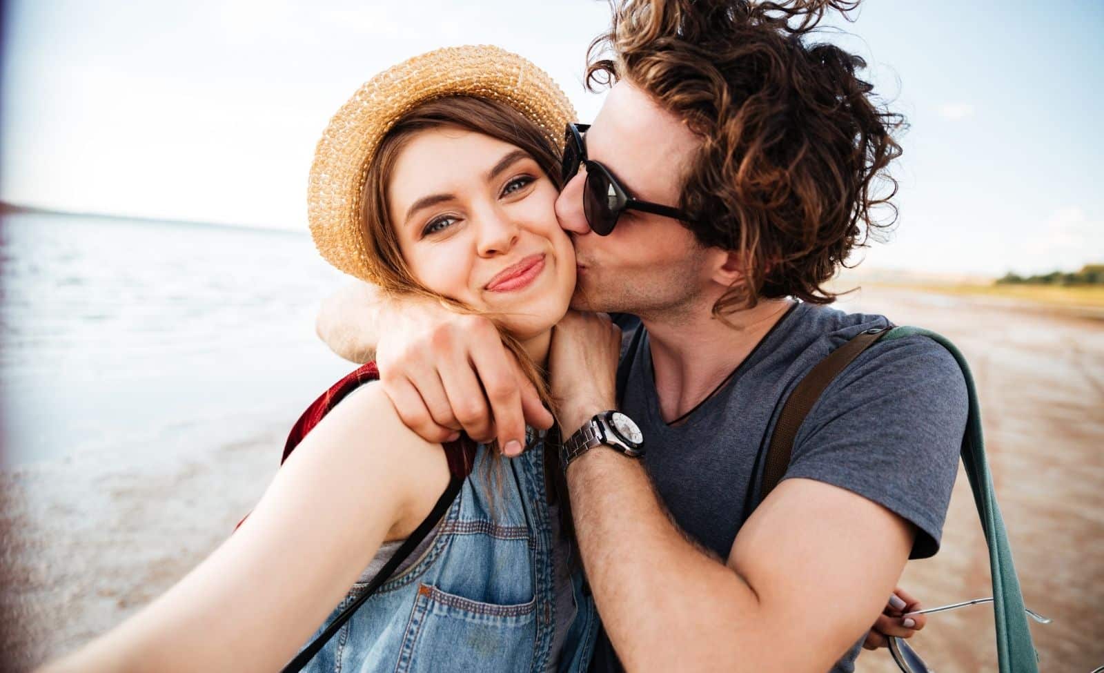 Couple taking a romantic selfie on a sandy Wisconsin beach