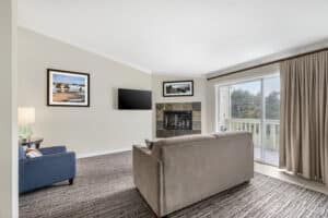 seating area in Queen Suite features fireplace, perfect for relaxing after a morning on the beach.