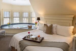 Suite at Carter House Inns with King Bed and jacuzzi tub in turret.