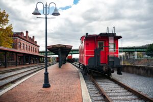Vintage Red Caboose at Cumberland Railroad station- perfect for scenic train rides in Maryland