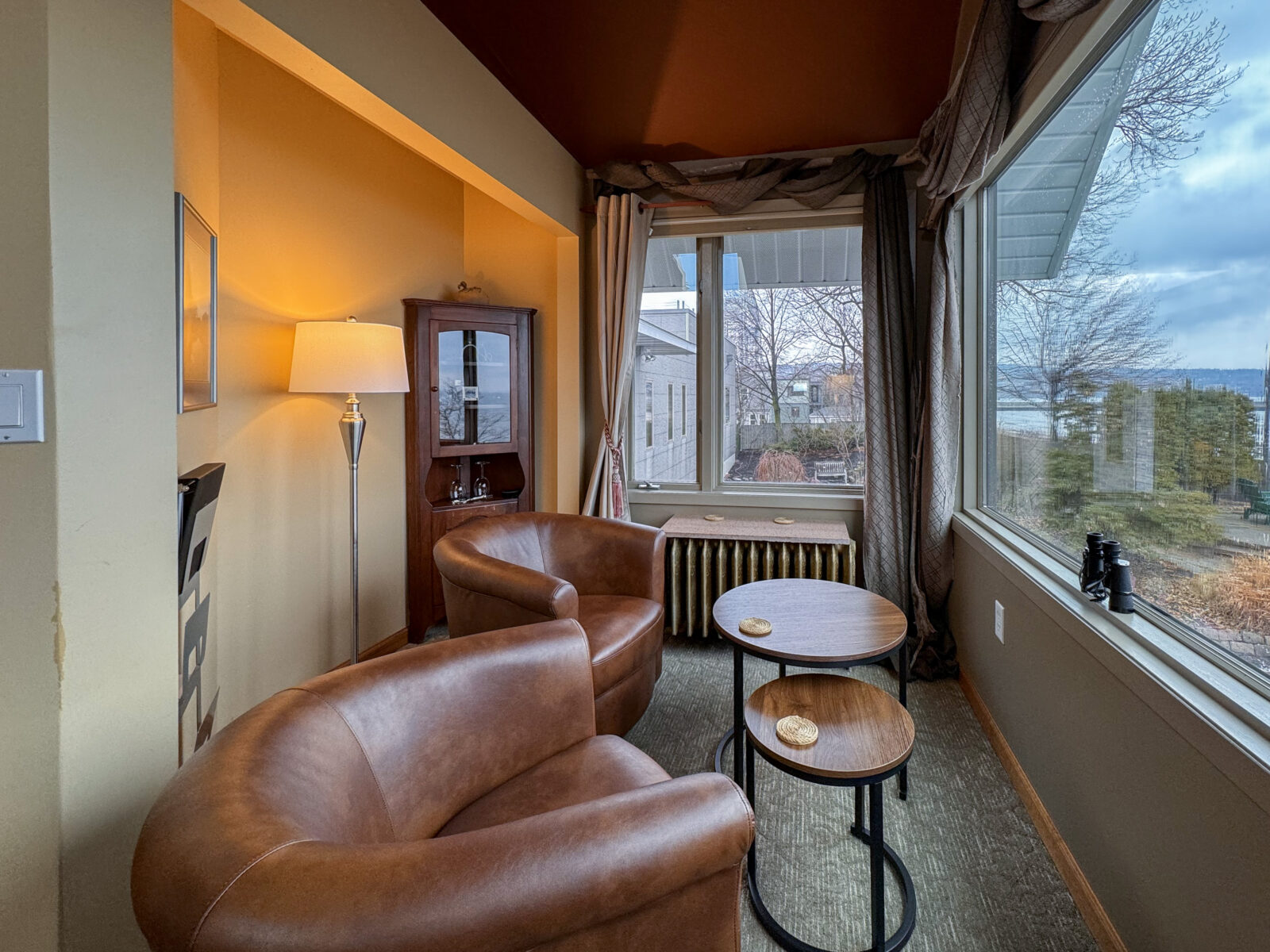 Seating area in the Lake Superior Suite offers large windows to view the freighter activity.